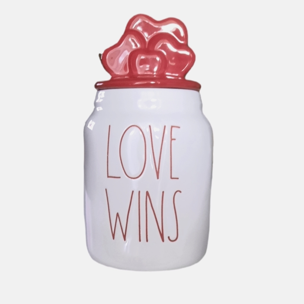 Rae Dunn Love Wins jar with hearts topper
